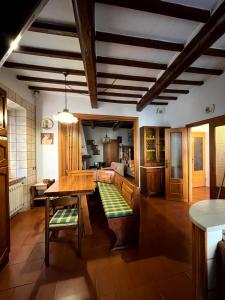 a living room with a table and a couch at L'Appaltino Cuore Medievale di Radicofani in Radicofani