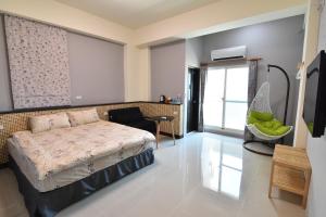 Tempat tidur dalam kamar di Com Inn-花蓮後車站電梯停車場
