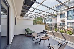 Balkón nebo terasa v ubytování 遇萌悦漫居酒店绍兴鲁迅故里景区仓桥直街店