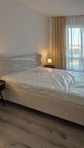 Ένα ή περισσότερα κρεβάτια σε δωμάτιο στο J'Luxury Apartment