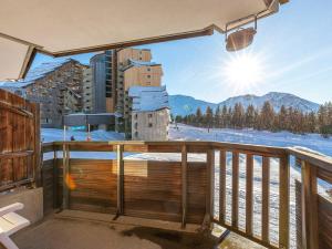 a balcony with a view of the mountains at Appartement cosy pour 6 près de l'ESF et du parking - FR-1-314-254 in Morzine