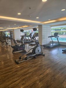 a gym with a bunch of exercise bikes in it at Studio apartment in Trendy Bankok in Bangkok