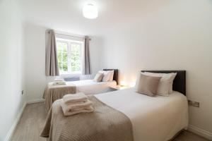 Ένα ή περισσότερα κρεβάτια σε δωμάτιο στο Riverside House