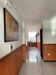 a hospital hallway with a large painting on the wall at Relax Homestay Phú Yên in Tuy Hoa