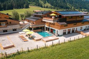 an aerial view of a house with a swimming pool at Alpin Chalet Kleinarl in Kleinarl