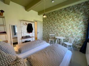 Ένα ή περισσότερα κρεβάτια σε δωμάτιο στο Gulfhof Groß Schulenburgerpolder