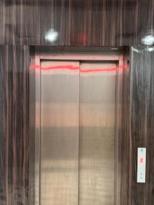 a close up of a metal door in a building at Hotel Yash in Prayagraj