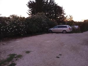 a car parked on the side of a dirt road at La Casa di Anna in Sassari
