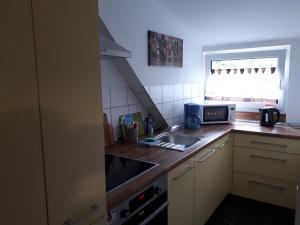 Kuchyň nebo kuchyňský kout v ubytování Monteurwohnung mit 3 Schlafzimmer Haus 9 + 2 fotografie