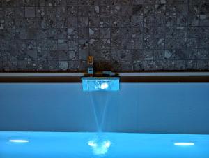a swimming pool with a sign in the water at Residenza Baronale Fiuggi in Fiuggi