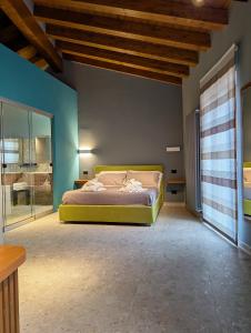 a bedroom with a bed in a room with blue walls at Residenza Baronale Fiuggi in Fiuggi