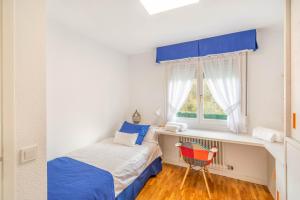 Ένα ή περισσότερα κρεβάτια σε δωμάτιο στο Gran casa de campo ideal para familias en Navarra