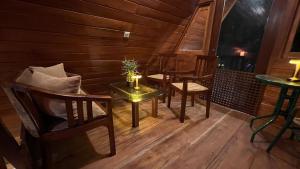 a room with chairs and a table with a candle at Siri Villa Cabana Habaraduwa in Habaraduwa +37 photos