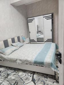 Postel nebo postele na pokoji v ubytování Grand Park Apart