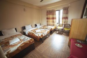 Cama ou camas em um quarto em Paundur Community Homestay