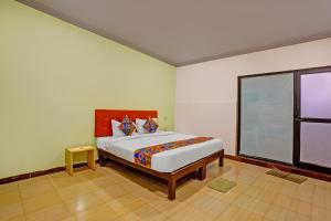 En eller flere senge i et værelse på FabHotel Baga Village Home- Nr Baga Beach + 22 billeder