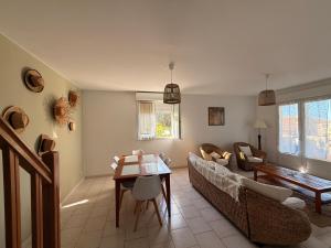 a living room with a couch and a table at Manureva Calvi in Calvi +66 photos