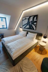 a bedroom with a large bed in a room at Conlon House Lower East Side in Munich