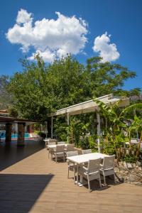 a patio with a table and chairs at TURUNÇ DREAM HOTEL in Mugla