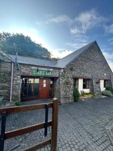 a small stone building with a shake bar on it at 61, Stowford Gardens in Combe Martin