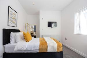 Ένα ή περισσότερα κρεβάτια σε δωμάτιο στο Cosy apartment in the heart of Sale