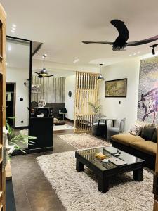 a living room with a couch and a coffee table at Home away from your home in Islamabad