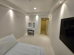 Giường trong phòng chung tại Han River KS Stay