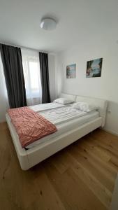 a large bed in a room with at Heaven Luxury Stay - Prime Location with Free Parking in Sarajevo