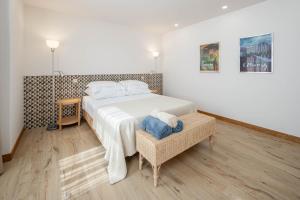 Giường trong phòng chung tại Quinta do Linharinho +25 ảnh