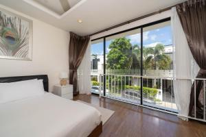 Ένα ή περισσότερα κρεβάτια σε δωμάτιο στο Laguna Park 10 minutes walk to Bangtao Beach +45 φωτογραφίες