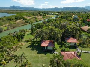an aerial view of a river and a resort at Gîte Les Escales La Marina in Bouloupari