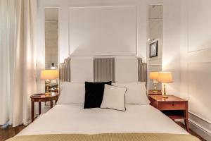 Ένα ή περισσότερα κρεβάτια σε δωμάτιο στο Piazza Venezia Luxe Apartment