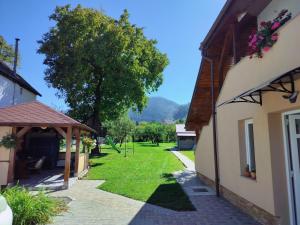 a view of a yard between two buildings at Casa Opal in Săcele