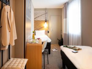 Postel nebo postele na pokoji v ubytování ibis Geneve Centre Lac + 59 fotografií