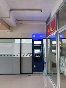 an atm machine in a shopping mall with its doors open at Hillside Condo 2 in Chiang Mai