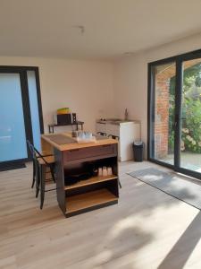 an office with a desk in a room at Appartement dans grange rénovée in Meilhan