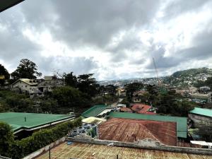 a view of a city with a roof at Rest Terraces Transient House in Baguio