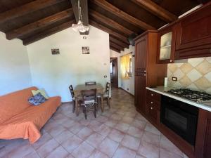 a bedroom with a bed and a table in a room at Agriturismo Le Roncacce in Abetone