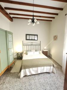 Ένα ή περισσότερα κρεβάτια σε δωμάτιο στο Casa Victoria i Ernesto