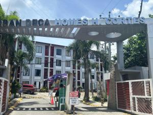a sign for a hotel in front of a building at Jb Place Hernan in Cebu City