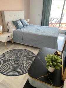 Ένα ή περισσότερα κρεβάτια σε δωμάτιο στο Marbella Costalita 1