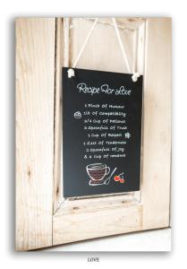 a chalkboard sign with a cup of coffee at Clarefoot Cottage in Moffat +21 photos