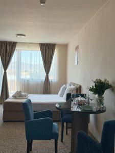 Postel nebo postele na pokoji v ubytování City Plaza