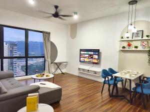 a living room with a couch and a tv at SQ31 Sq where 55 inch 4 ktv sungai buloh in Shah Alam