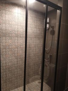 a shower with a glass door in a bathroom at Exclusive Apartment with Pool - Self Check In in Hua Hin +33 photos