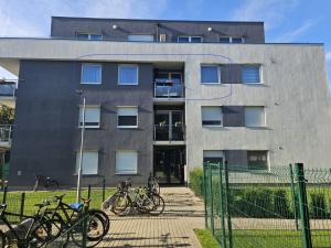 a building with bikes parked in front of it at Nono's Flat in Szombathely