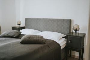 a bedroom with a large bed with two night stands at Hotel Central Vlašić in Vlasic