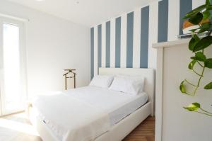 Postel nebo postele na pokoji v ubytování 60 passi dal mare-Charming CdO