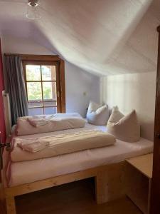 Postel nebo postele na pokoji v ubytování Häuschen Kunterbunt