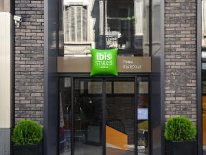 a sign on the front of a store at ibis Styles Tbilisi Center in Tbilisi City